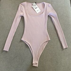 Zara Ribbed Long-Sleeve Bodysuit in Light Lavender Pink